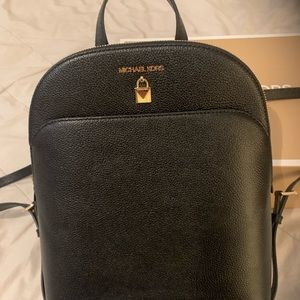 Brand new MK Adel Leather backpack with tag and box. Never been used.